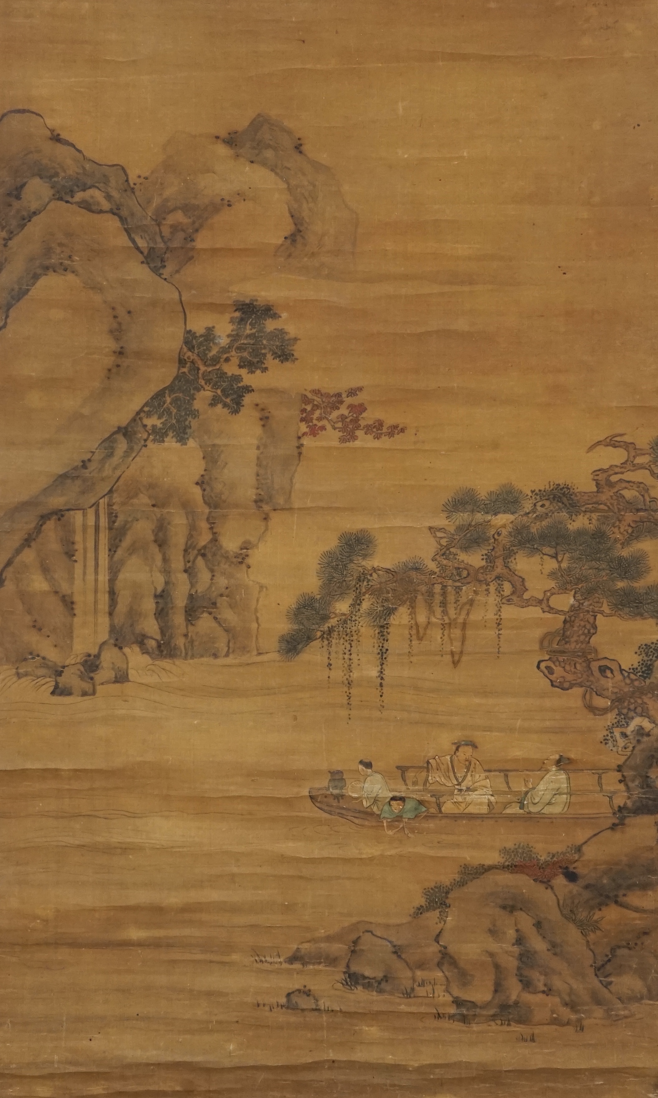 Chinese School, 18th century, a scroll painting on silk of figures on a boat, signed Qiu Ying